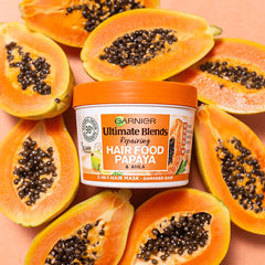 Garnier Hair Food Papaya 3-in-1 papaya slices highlight natural extracts for shine.
