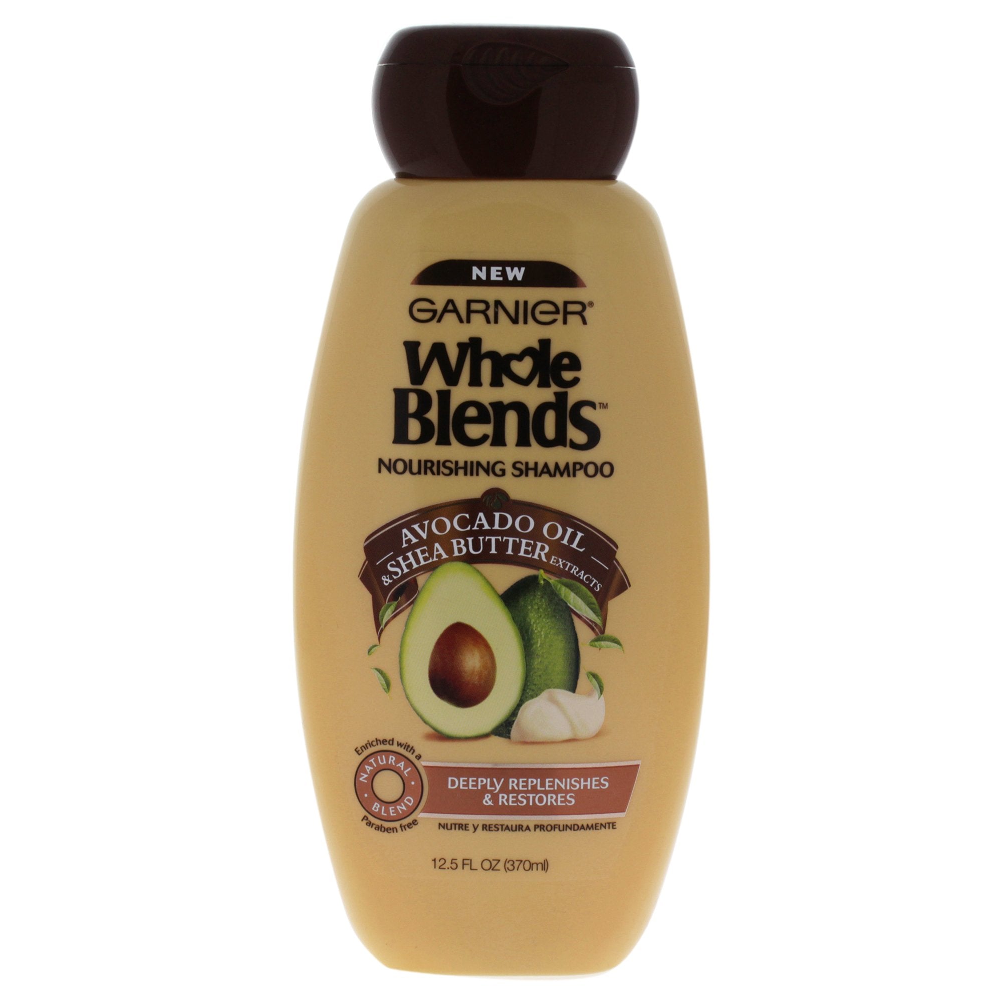 Garnier Whole Blends avocado-oil shampoo bottle for nourished hair and gentle cleansing.