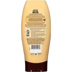 Garnier Whole Blends conditioner being applied to hair for daily hydration