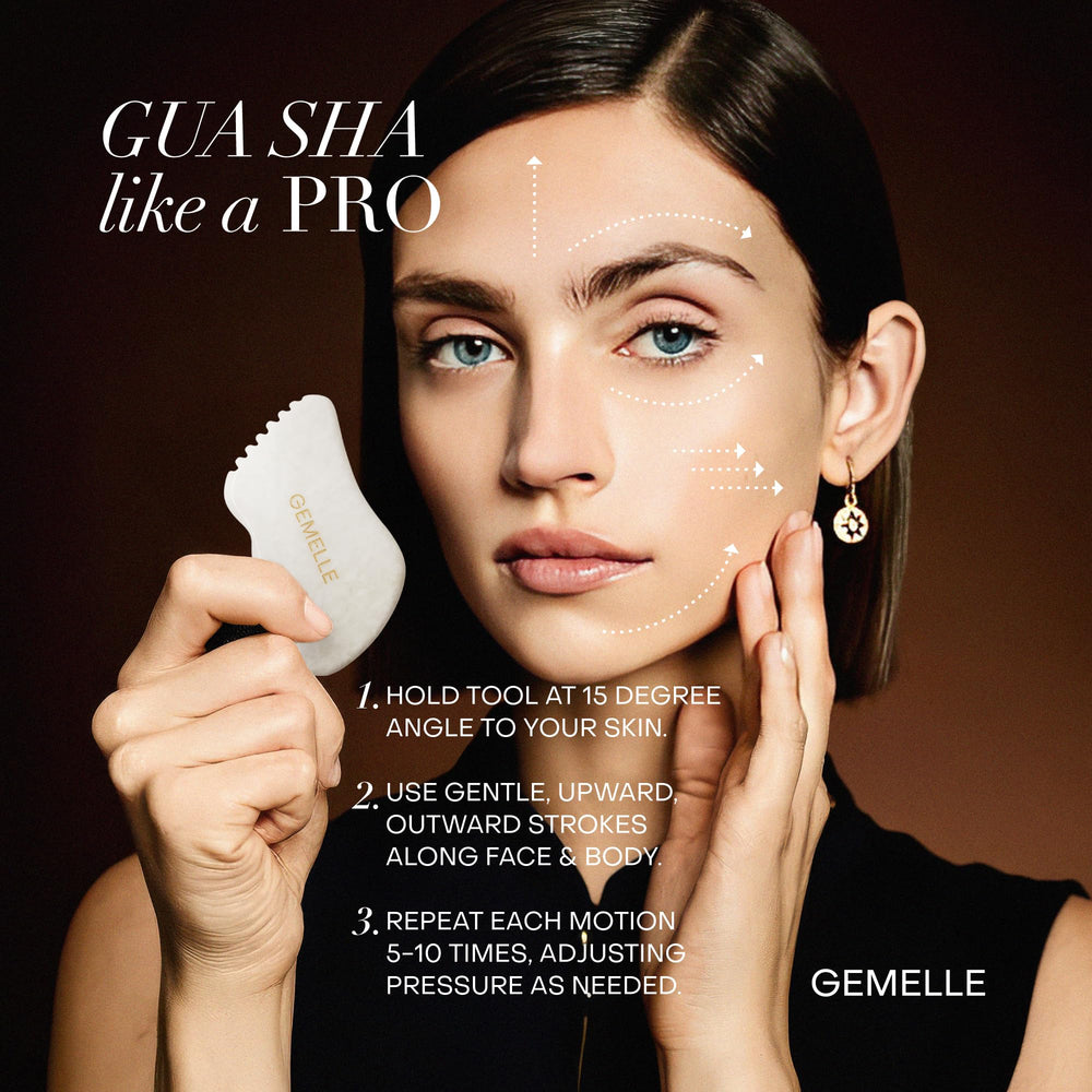 GEMELLE White Jade Gua Sha tool performing lymphatic drainage on cheek and neck