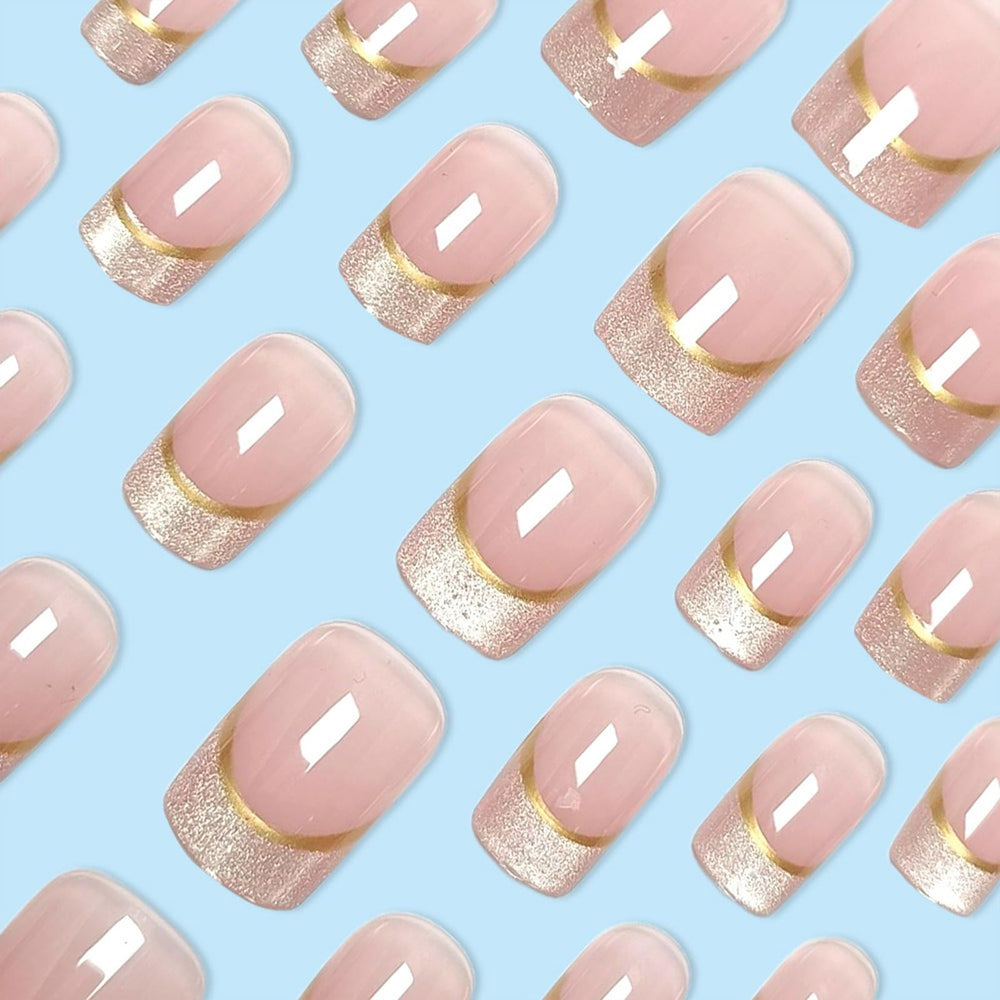 Generic French nails with gold stripes for chic dressy style.
