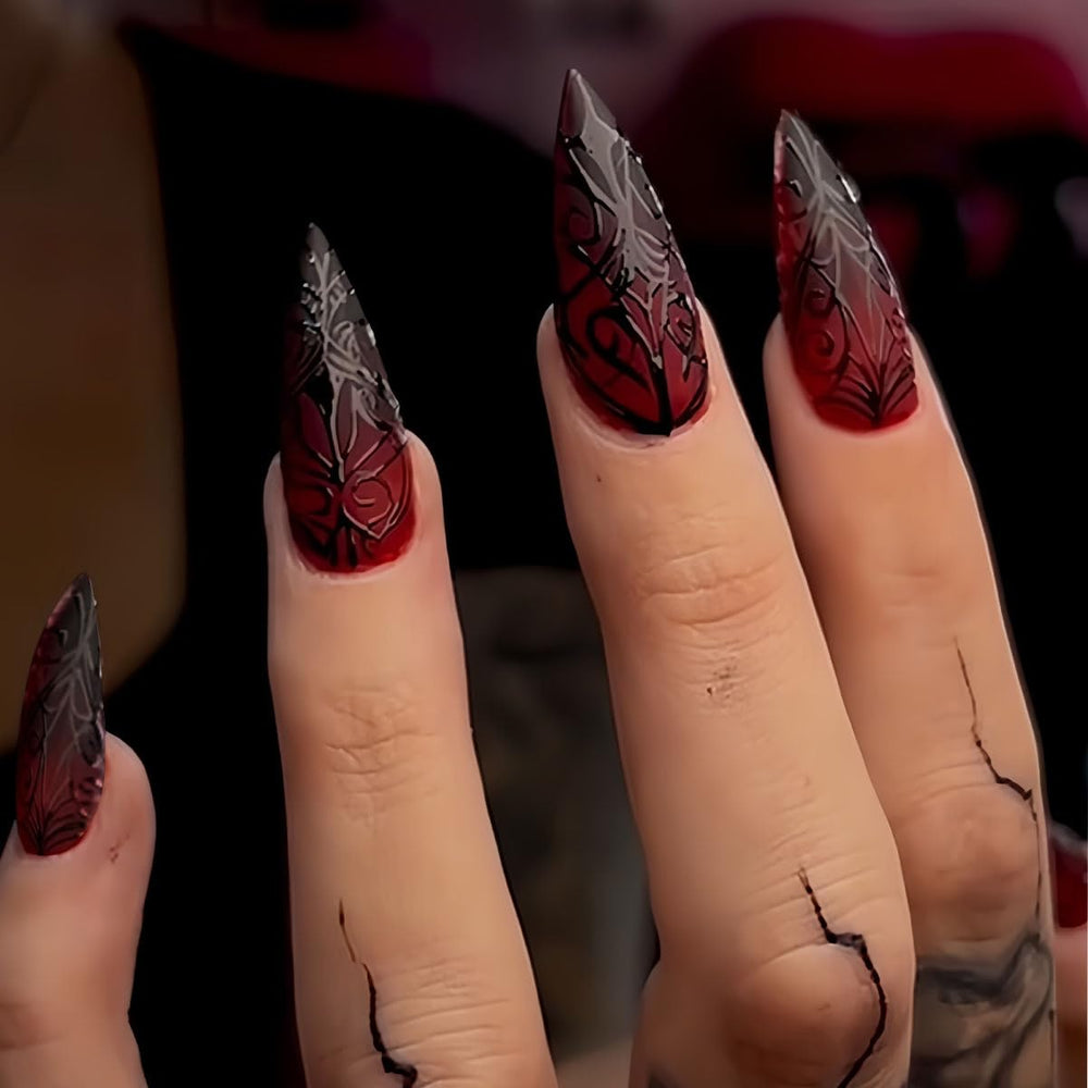 Generic Halloween nails stiletto almond red 3D stripe design enhances dramatic look for parties.