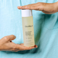 Geologie Acne Control Body Wash backlit label showcases fragrance-free formula.