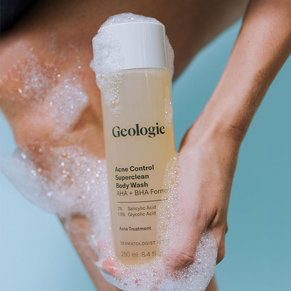 Geologie Acne Control Body Wash bathroom setup features sleek eco-friendly bottle.