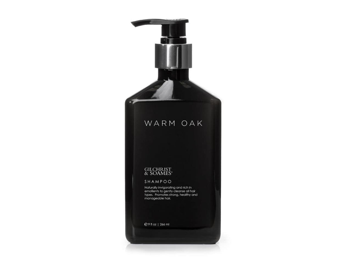 Gilchrist & Soames Warm Oak Shampoo bottle pour showcases easy cleansing for all hair types.