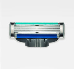 Gillette Mach 3 Turbo refill blades close-up shows triple blades for a smoother shave.
