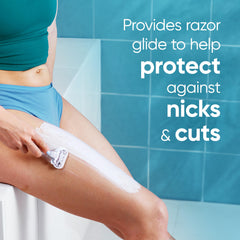 Applying Satin Care Dry Skin shave gel to wet skin to form rich lather for protection.