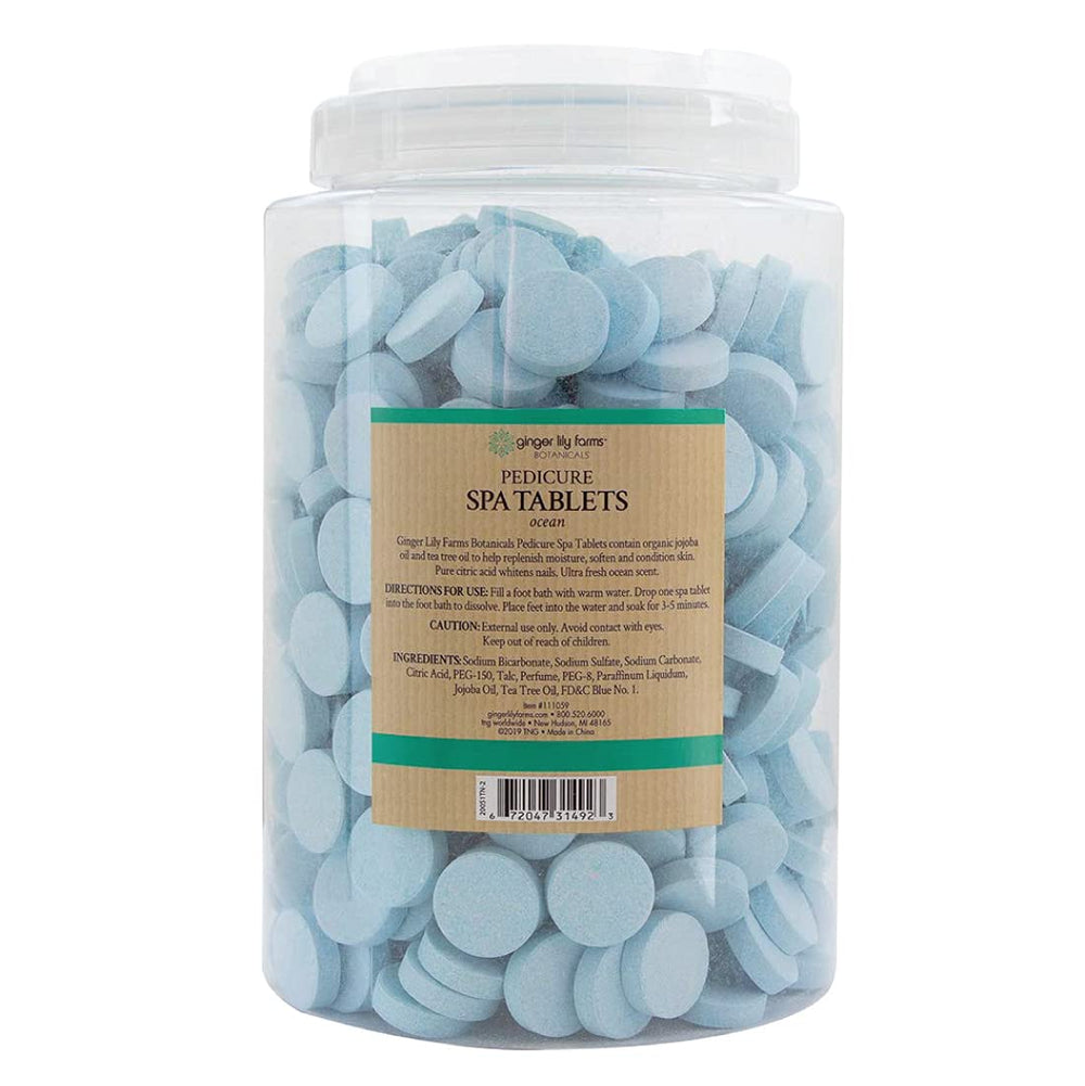 Ginger Lily Farms Botanicals dissolving tablet in water demonstrates quick effervescence for foot soak.