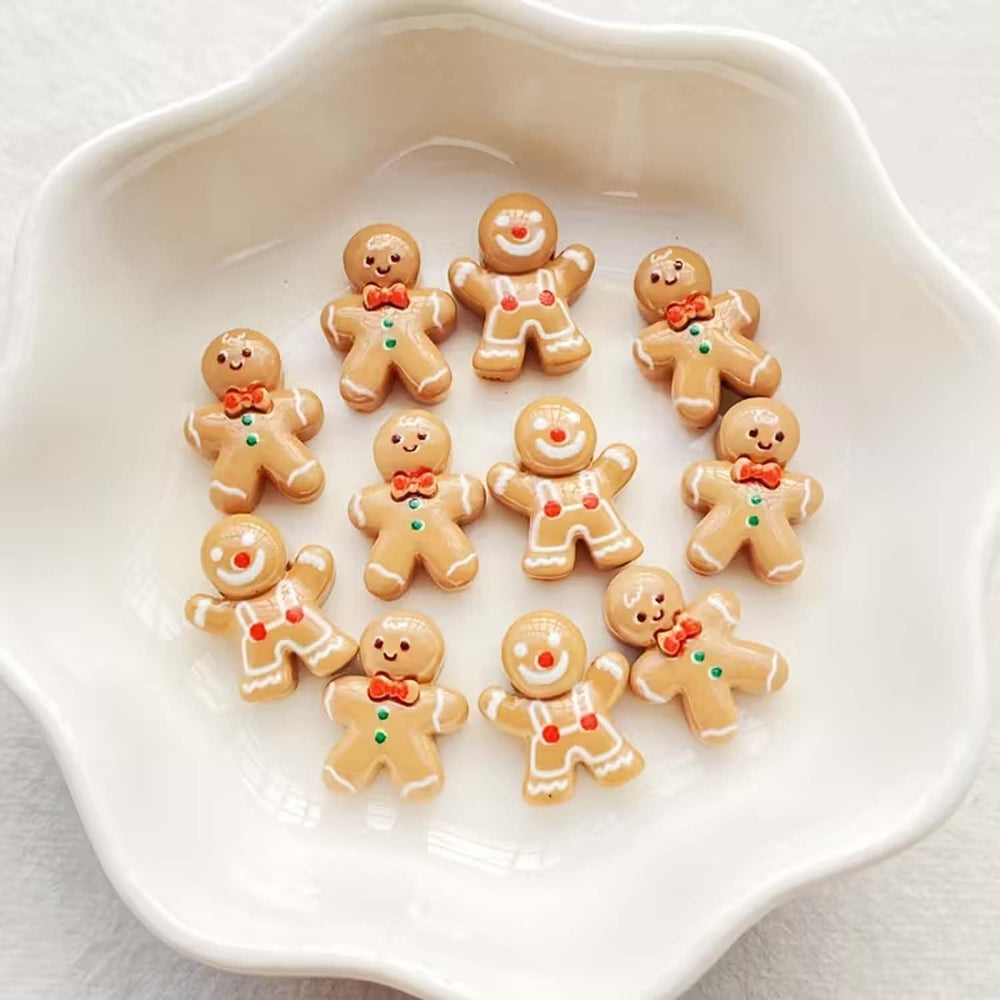 Gingerbread-man nail charms on nails for quick festive DIY manicure