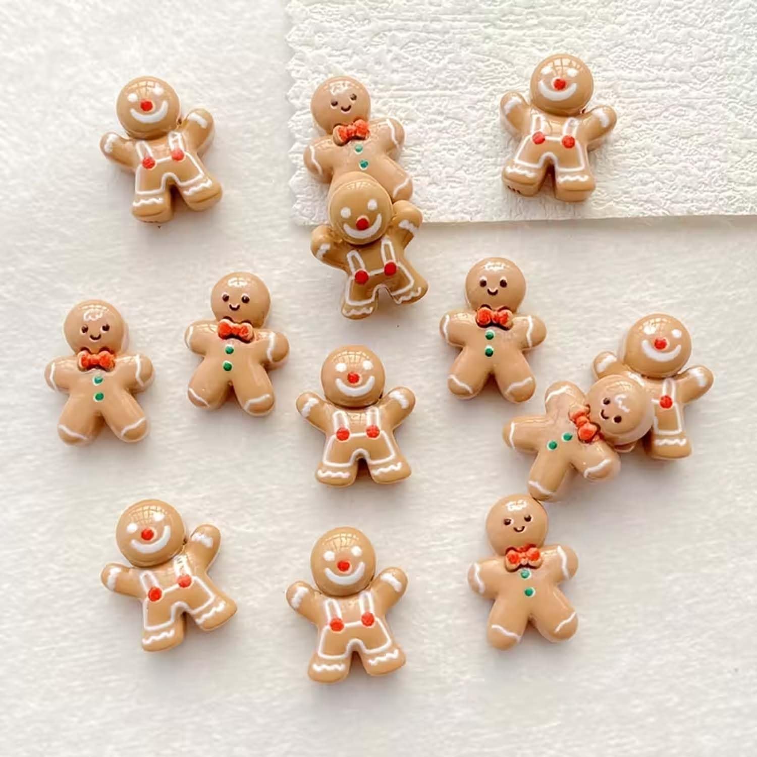 Gingerbread-man nail charms packaging shot showing the 20-piece set