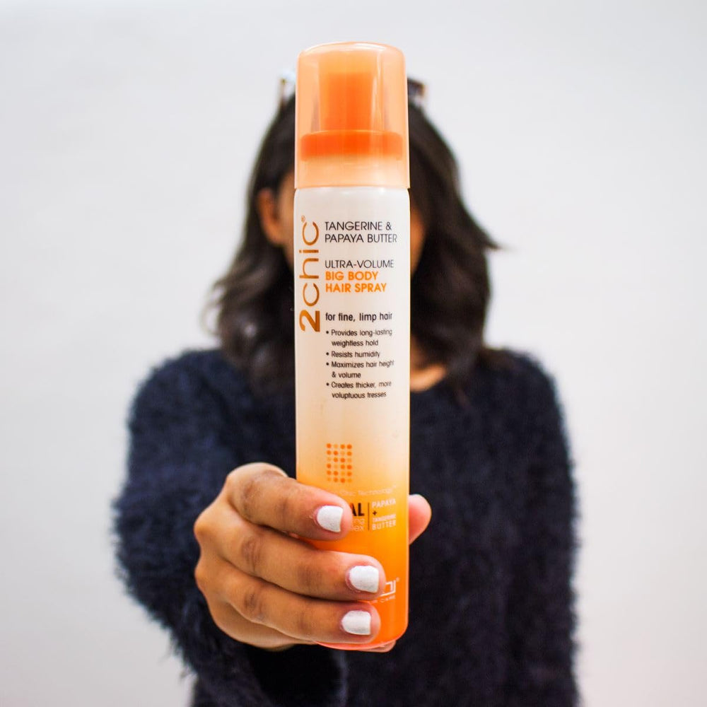 GIOVANNI papaya-tangerine butter close-up signals nourishing, color-safe care.