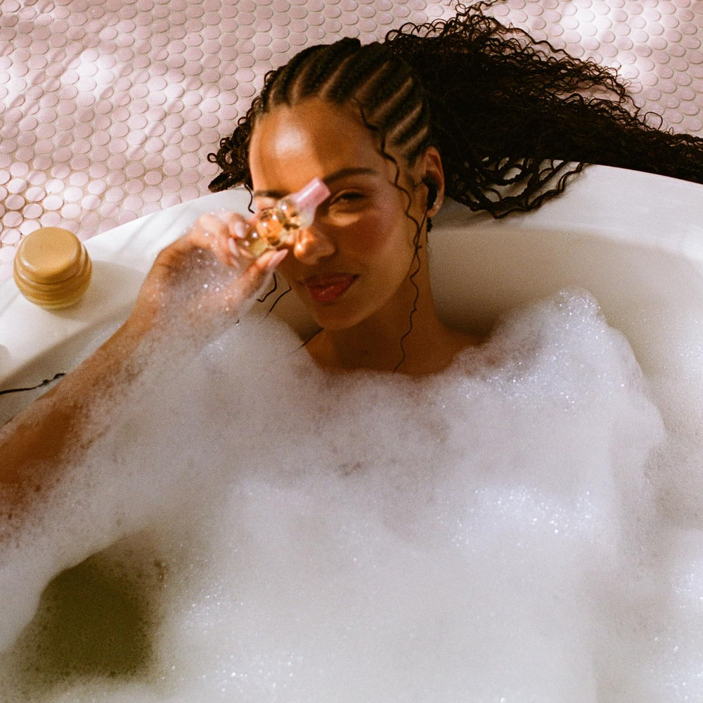 Gisou Honey Infused Hair Perfume honey drop closeup hints at natural honey blend.