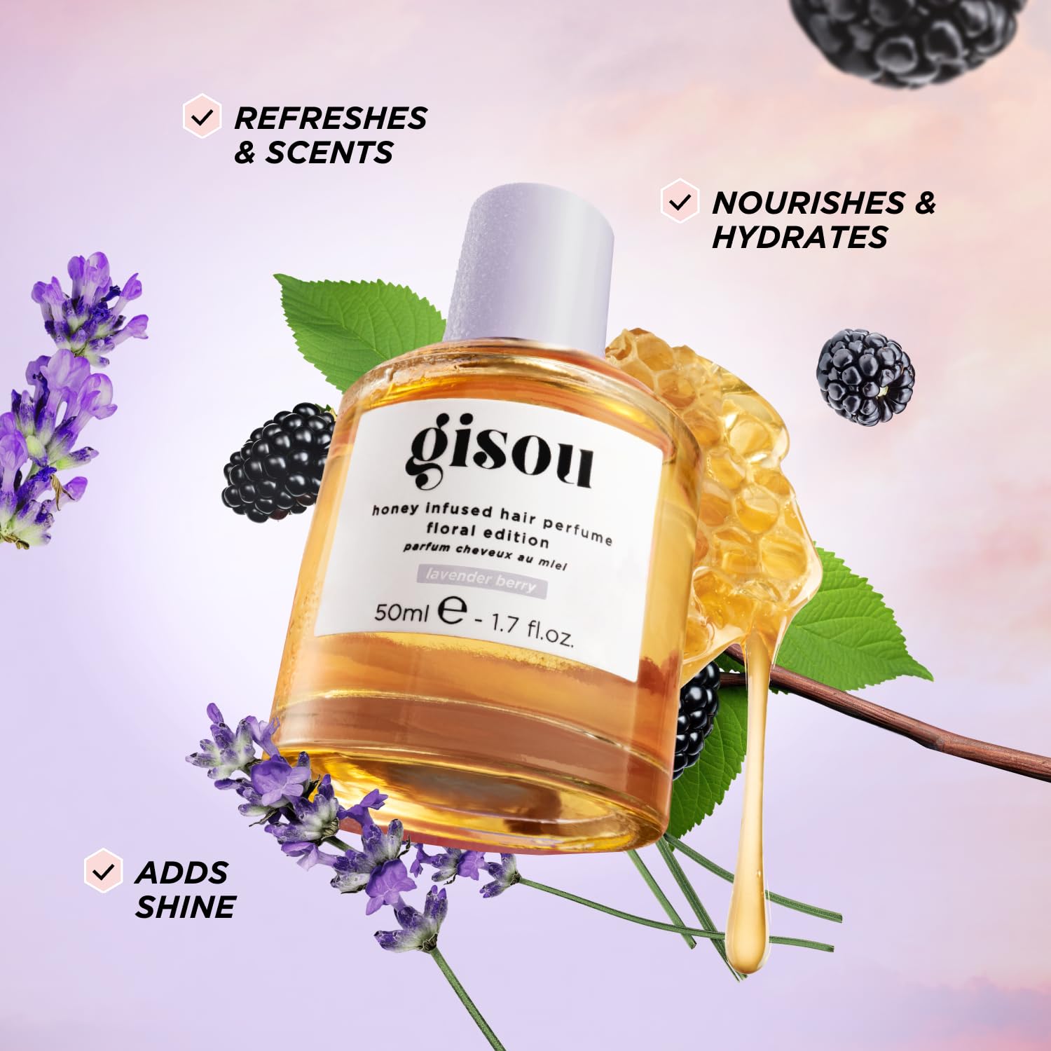 Gisou Honey Infused Hair Perfume spray delivering a fine mist for instant refresh.