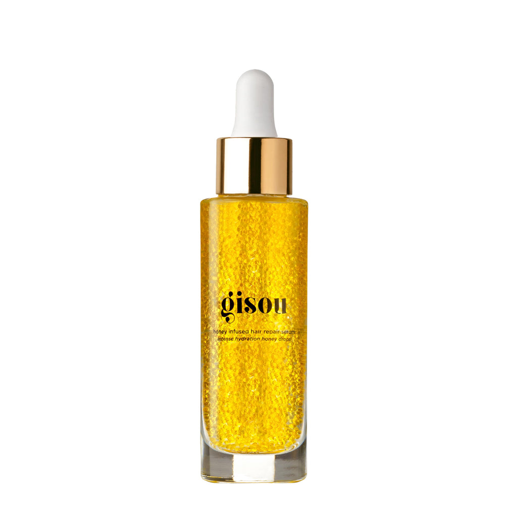 Gisou Honey Infused Hair Repair Serum bottle close-up showing glossy, frizz-free ends