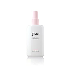 Gisou Honey Infused Leave-In Conditioner bottle on vanity for detangling and shine.