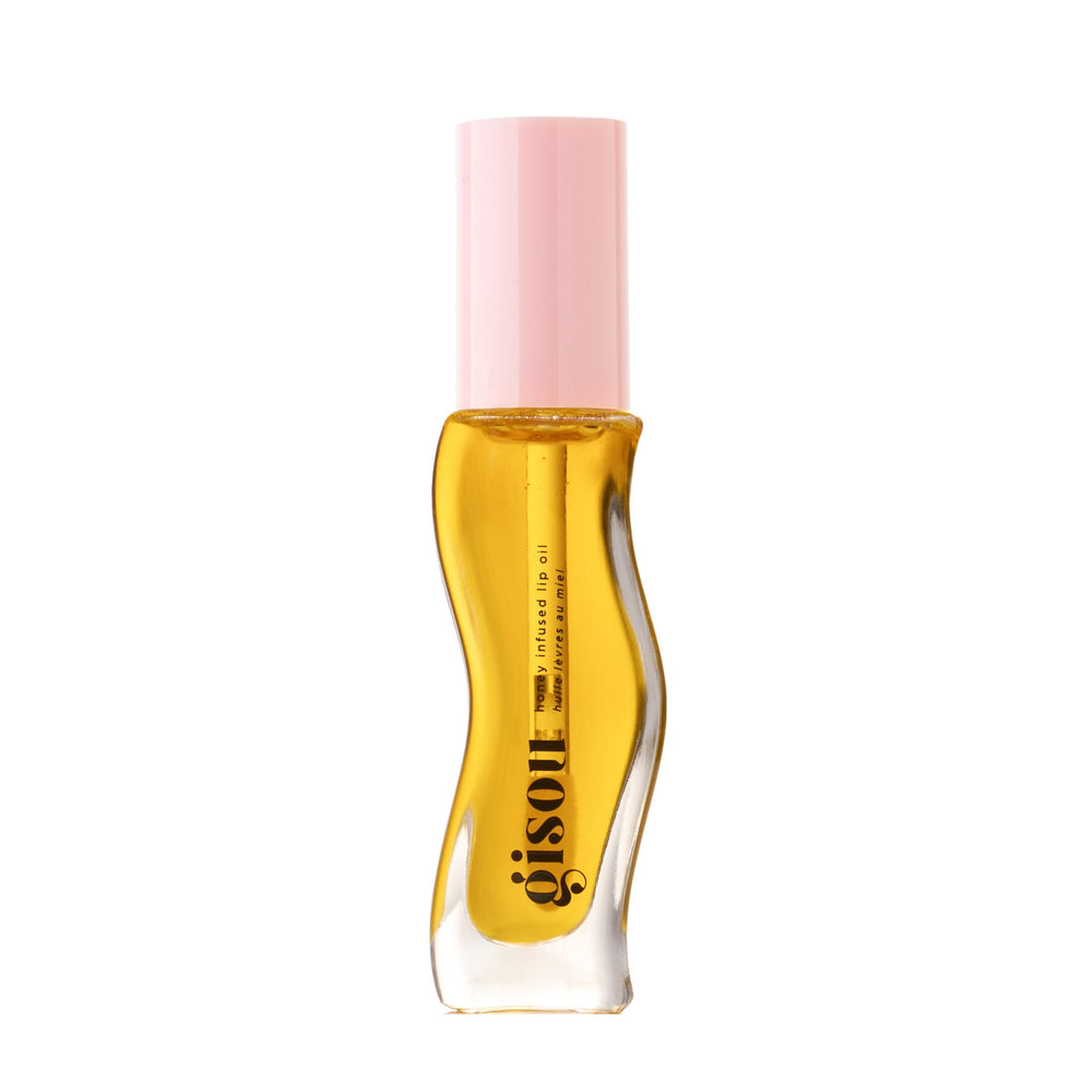 Gisou Honey Infused Lip Oil bottle gleams with hydrating shine for daily use.