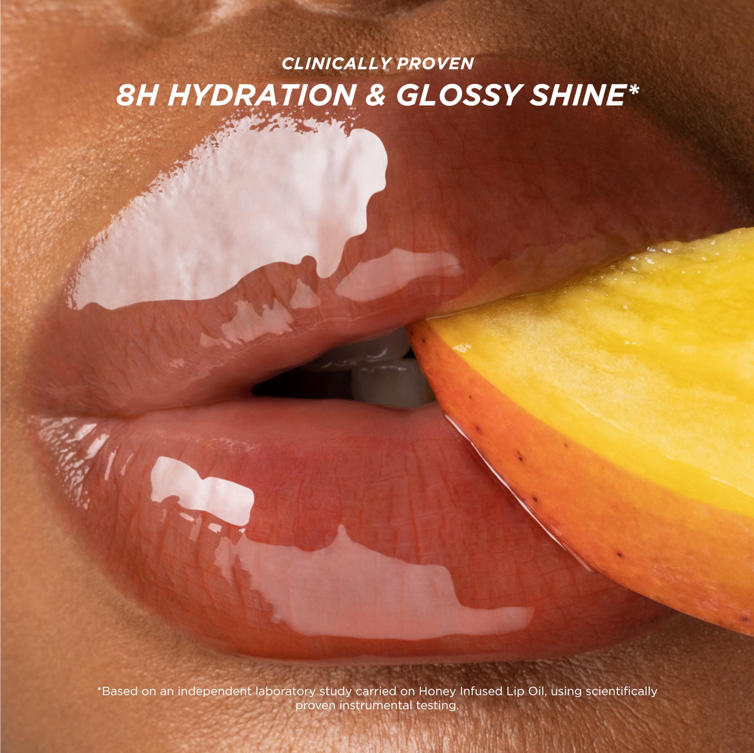 Gisou lip oil Mango Passion Punch on lips provides hydrated, high-gloss look.