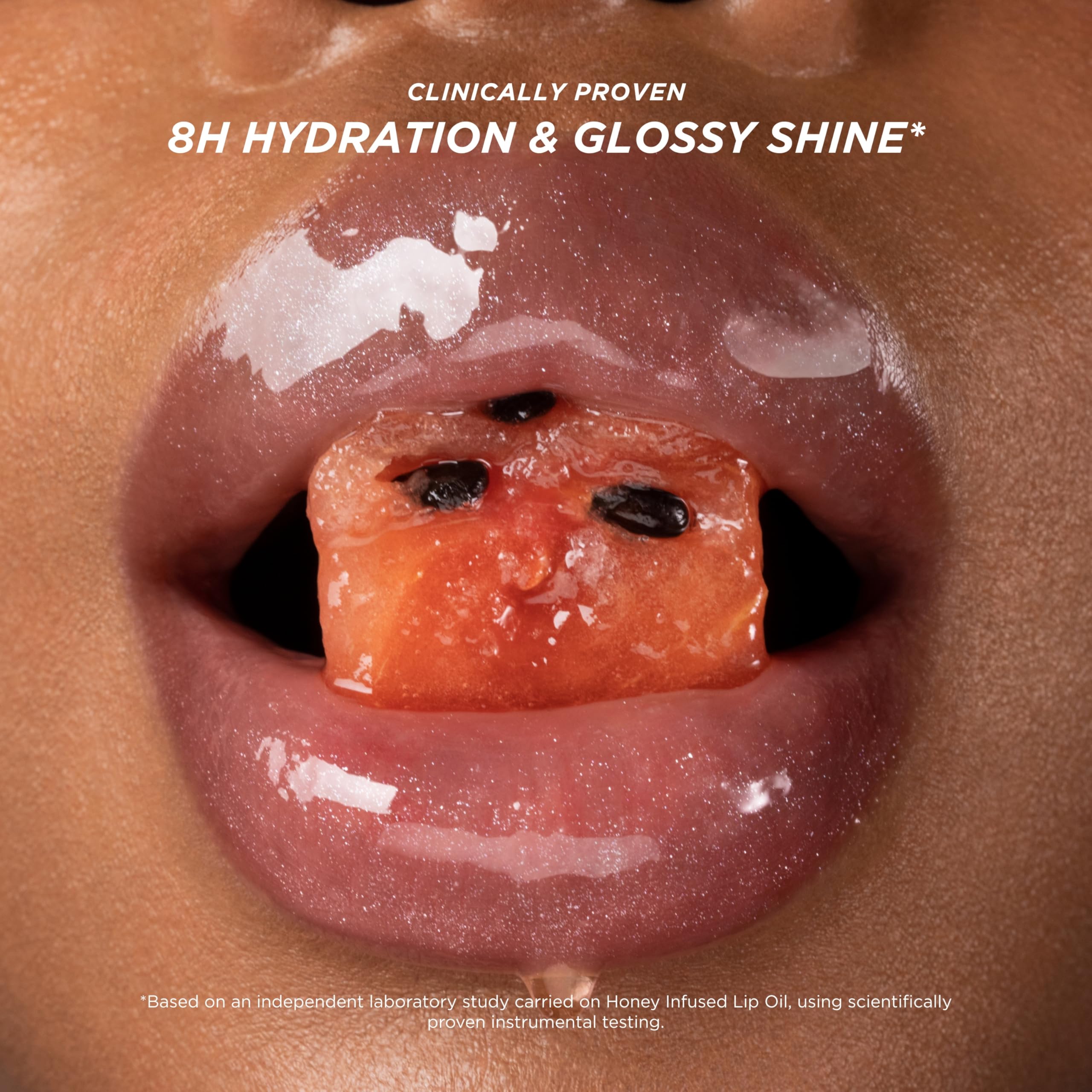 Gisou Honey Infused Lip Oil wear-alone-or-layered shot demonstrates layering for extra glow and color.