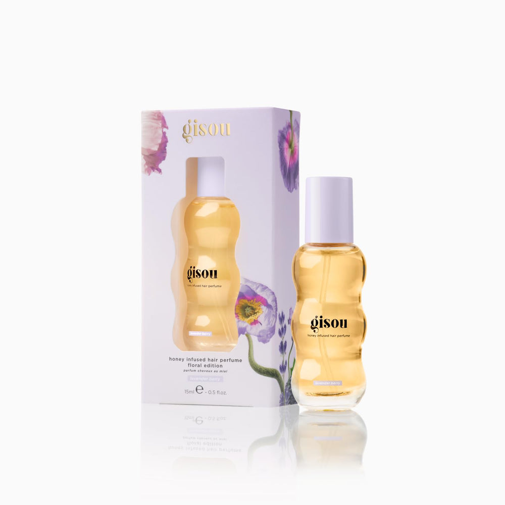 Gisou perfume mist dispersing a delicate fragrance through hair.