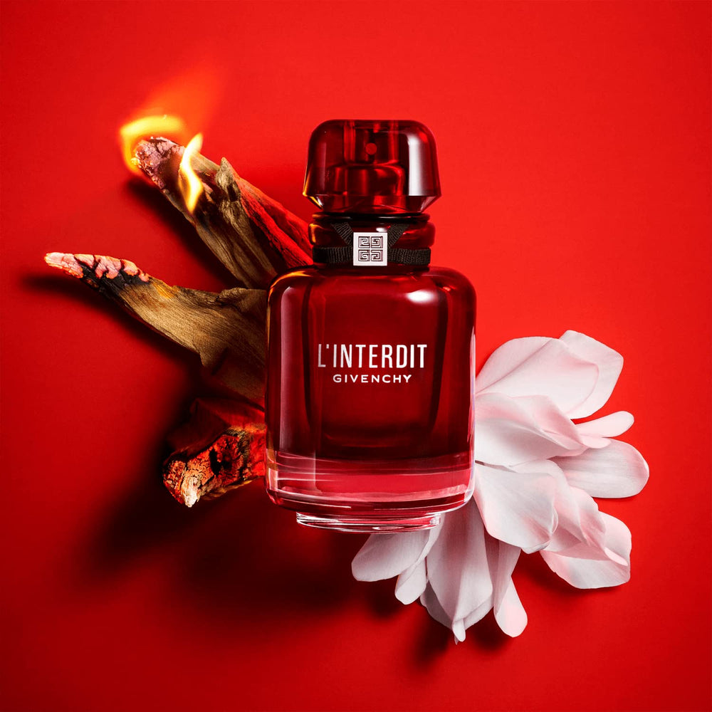 Givenchy L’Interdit Rouge bottle on surface conveys bold fragrance presence.