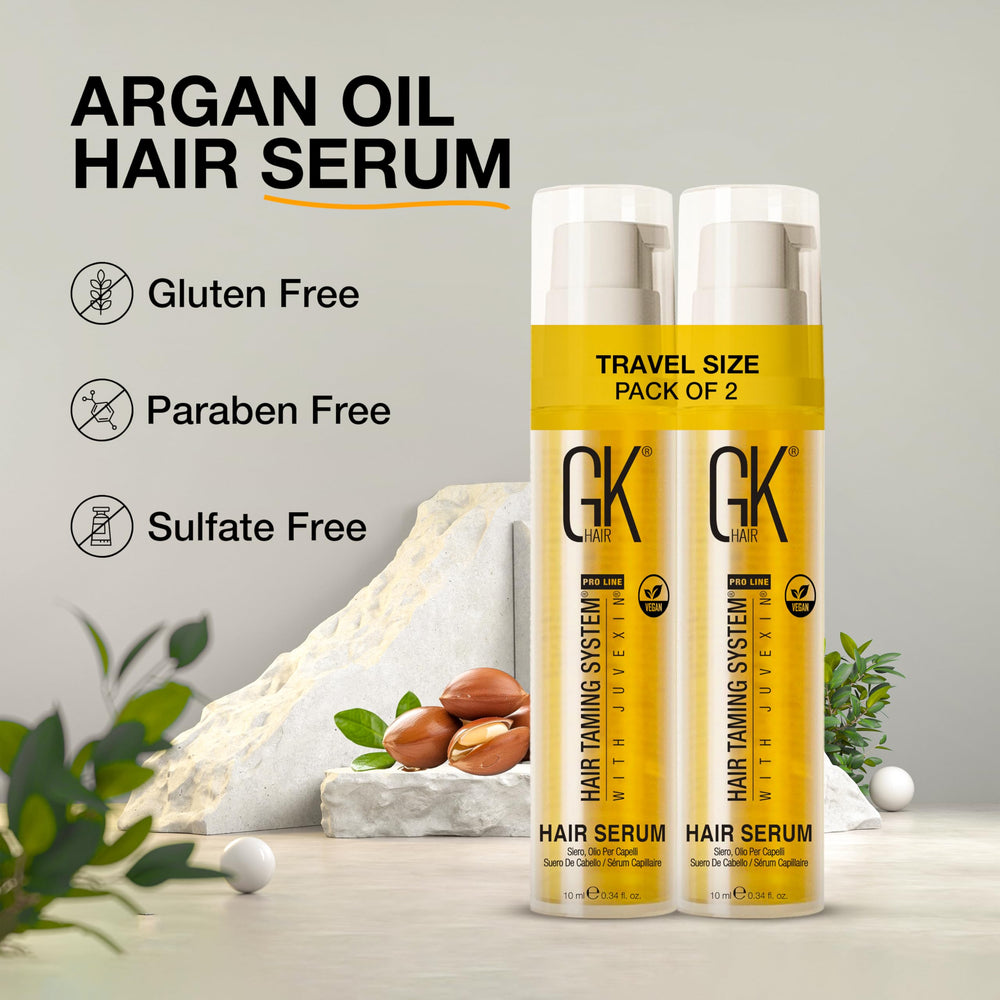 GK HAIR travel-size oil being applied to hair for detangled shine.