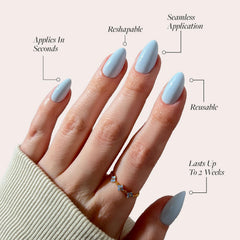 Glamnetic Blueberry Milk nails on hand demonstrates easy at-home application.