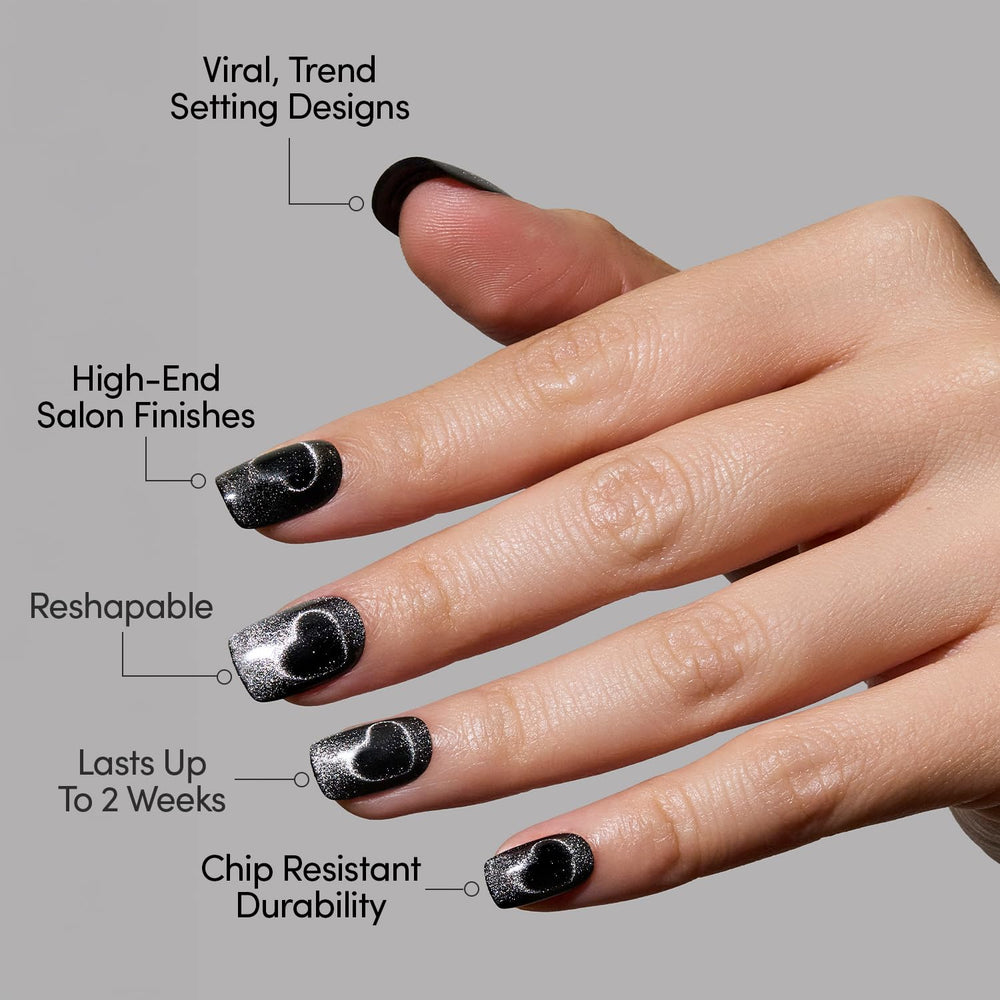 Glamnetic Midnight Romance nails swatch displays moody black finish with silver hearts.