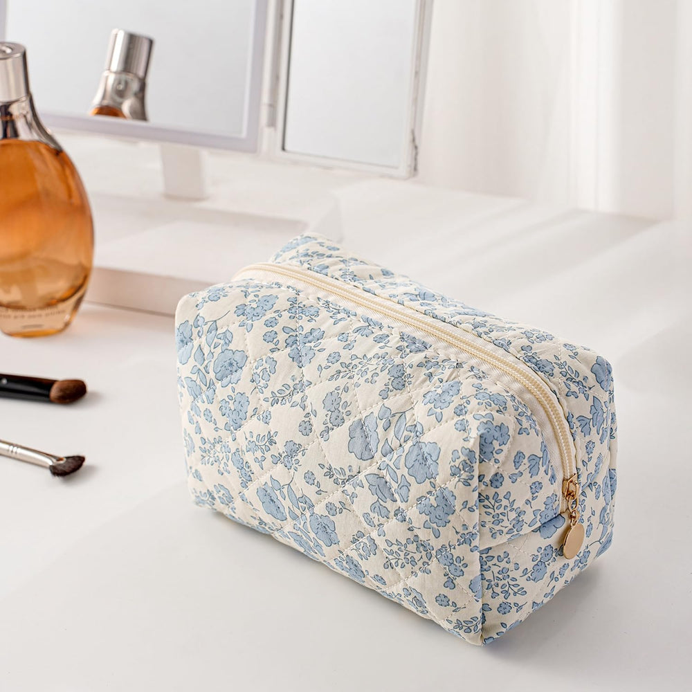 Gleyemor floral bow cosmetic bag in blue, side view, portable travel companion.