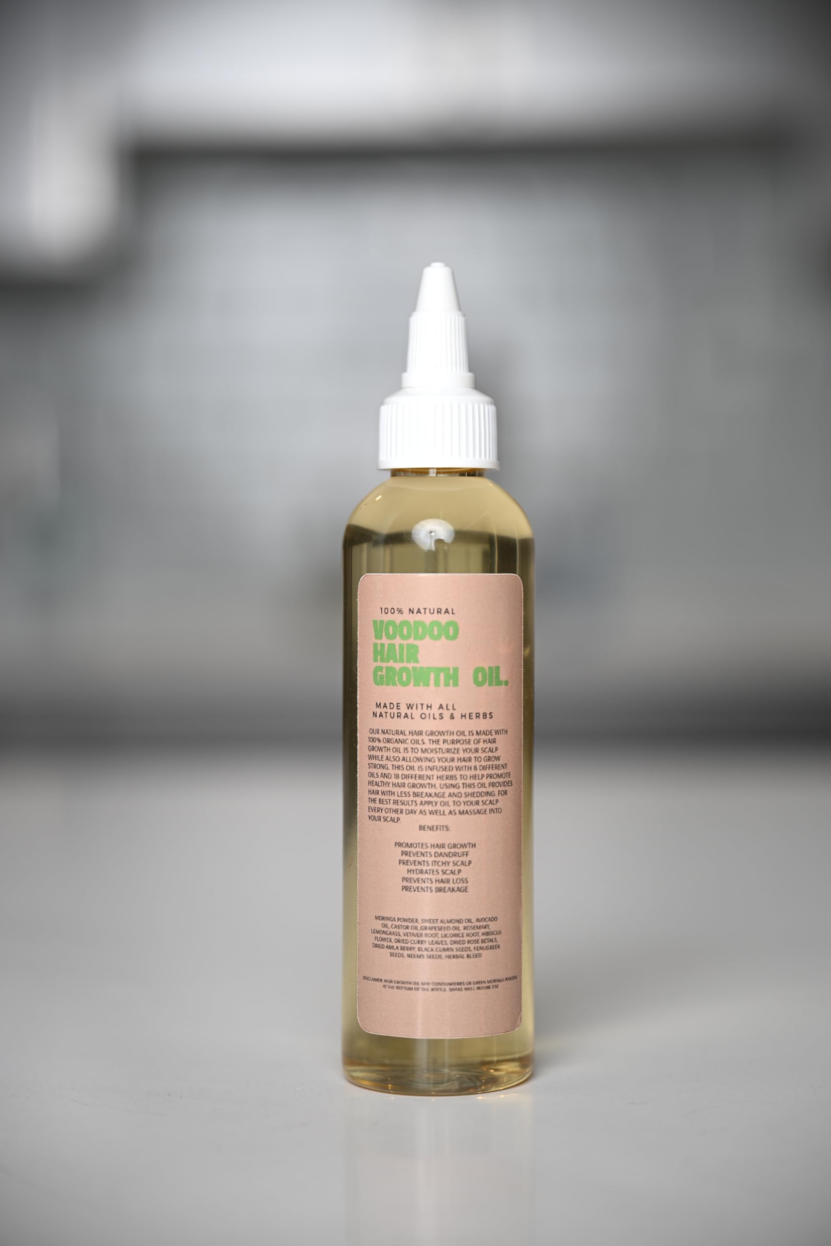 Lifestyle shot of Glossed by Nae Voodoo Hair Growth Oil featuring healthier-looking hair