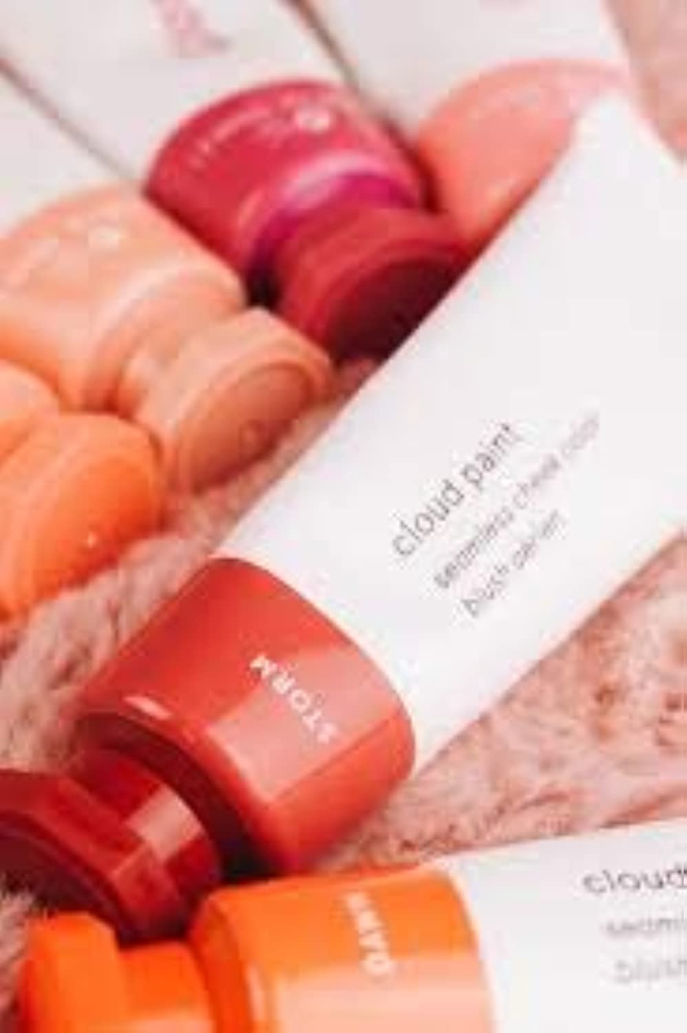 Glossier Cloud Paint Storm dab on cheek highlights easy application and long wear.