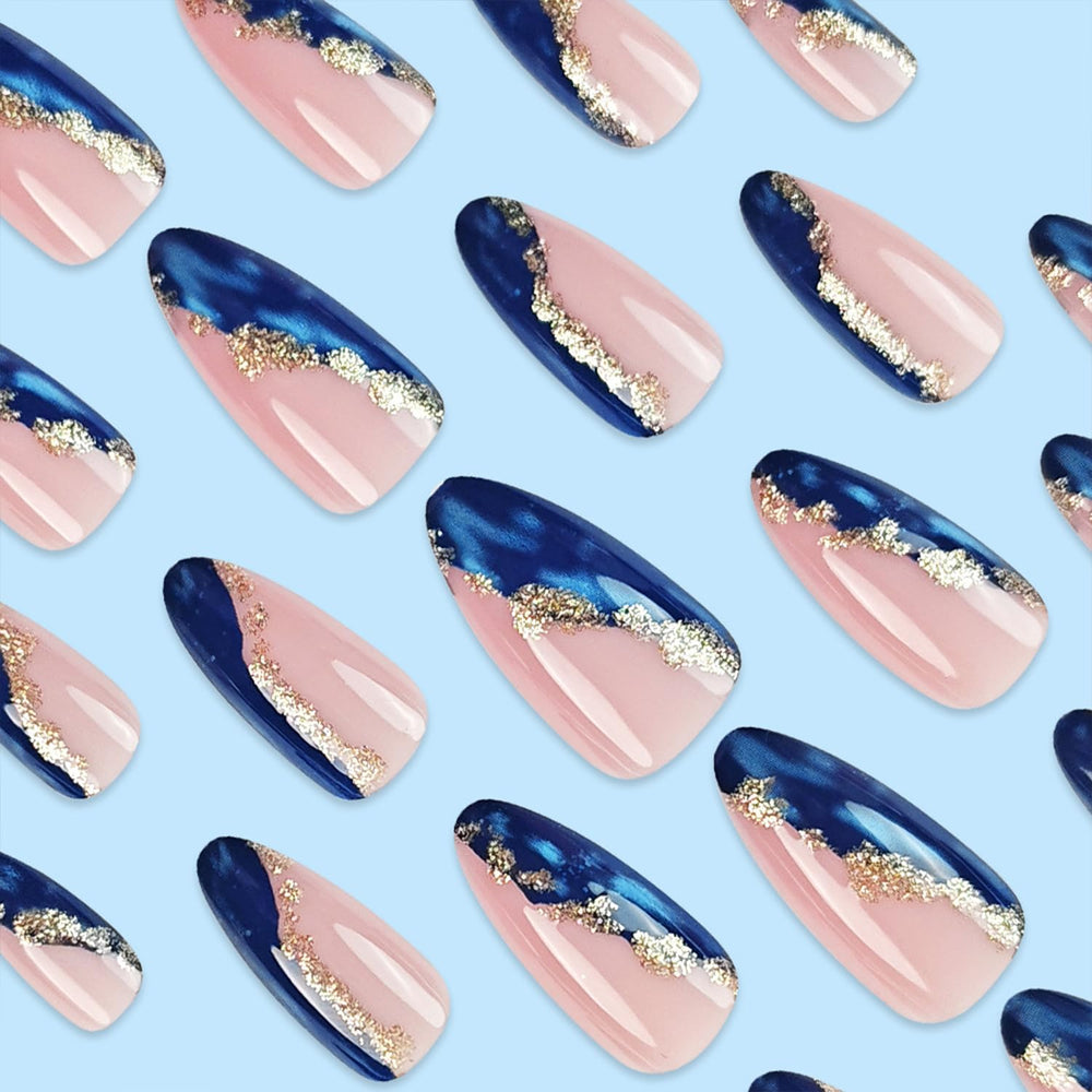 Gold Foil Blue Marble almond-shape nails provide a medium-length fit for versatile looks.