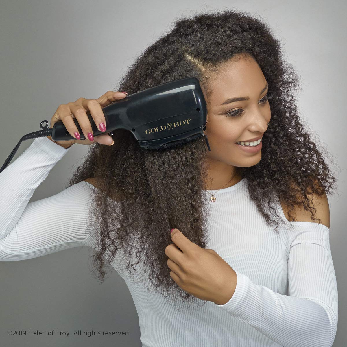 Gold N Hot smoothing brush attachment enhances volume and shine for versatile styling
