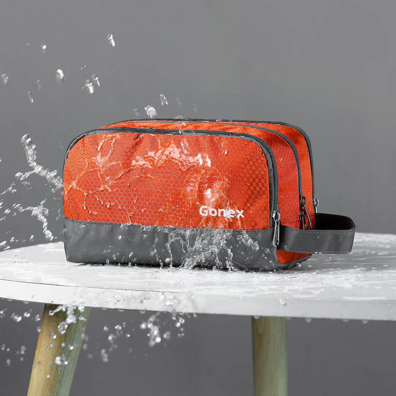 Gonex toiletry bag side view orange — compact organizer with side handle