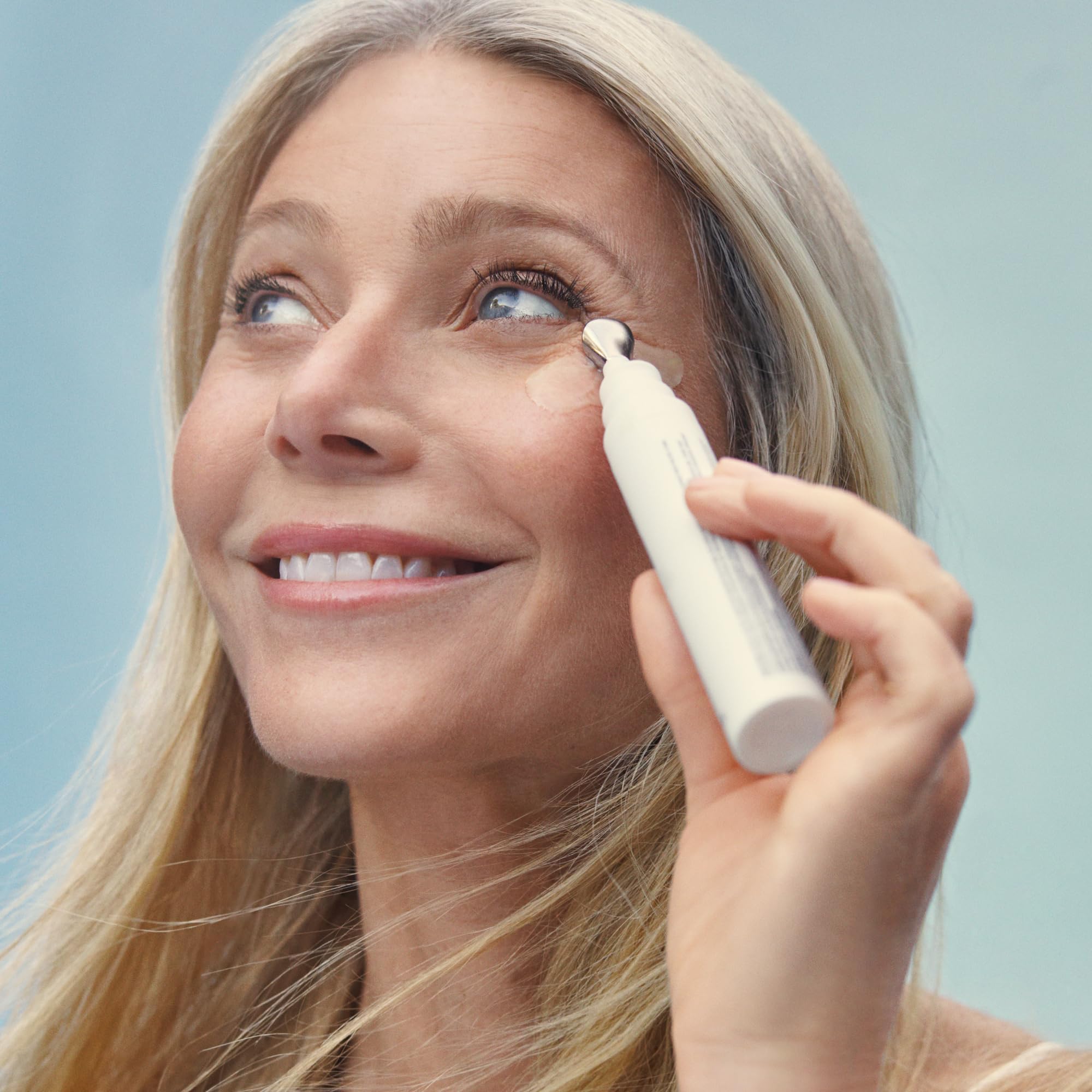 Goop Beauty 3x Retinol Eye Lift Serum closeup with cooling metal applicator for depuffing.