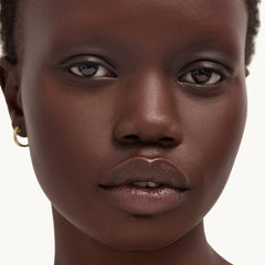 Goop Beauty Cleansing Balm makeup-removal shot—removes waterproof makeup and sunscreen while soothing skin.