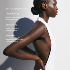 goop Beauty Glow Skin Highlighter Stick swatch on cheekbone reveals subtle radiance.