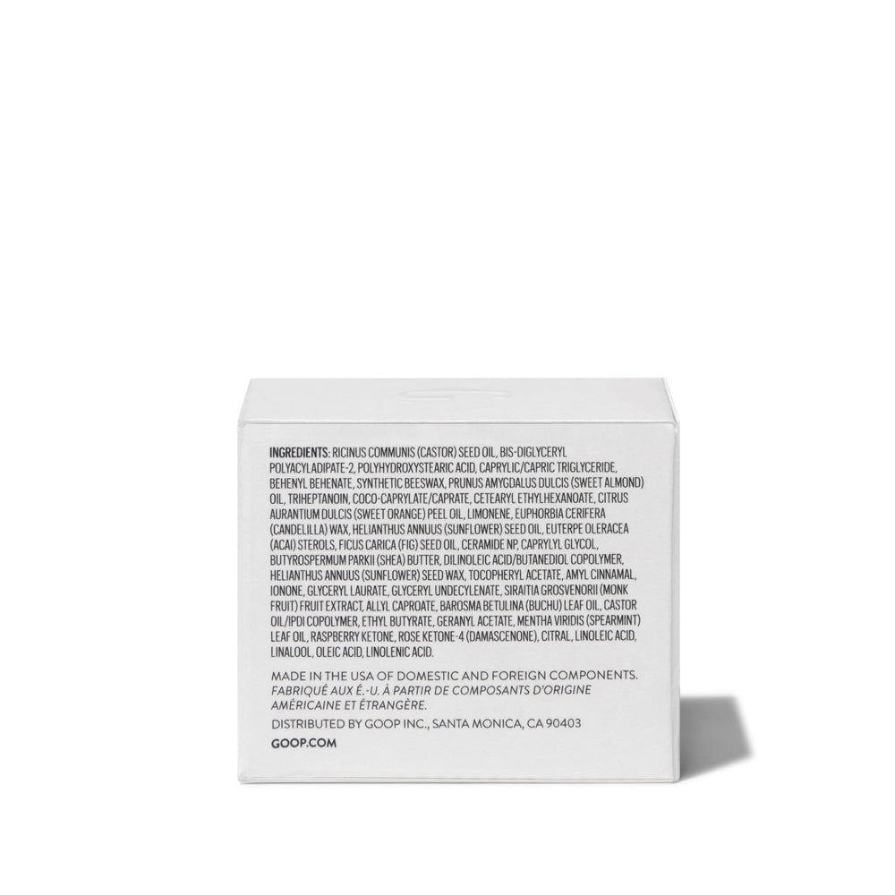 Goop Nourishing Lip Repair Mask jar and label under soft lighting for spa-like pampering.