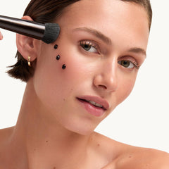 Goop Summertone Bronzing Gel swatch on skin displaying blendable color