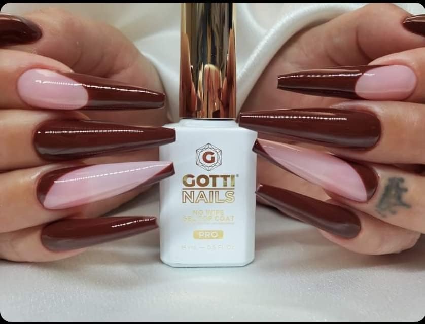 Gotti Nails Gel Top Coat Clear wet-look finish enhances gel nail depth.