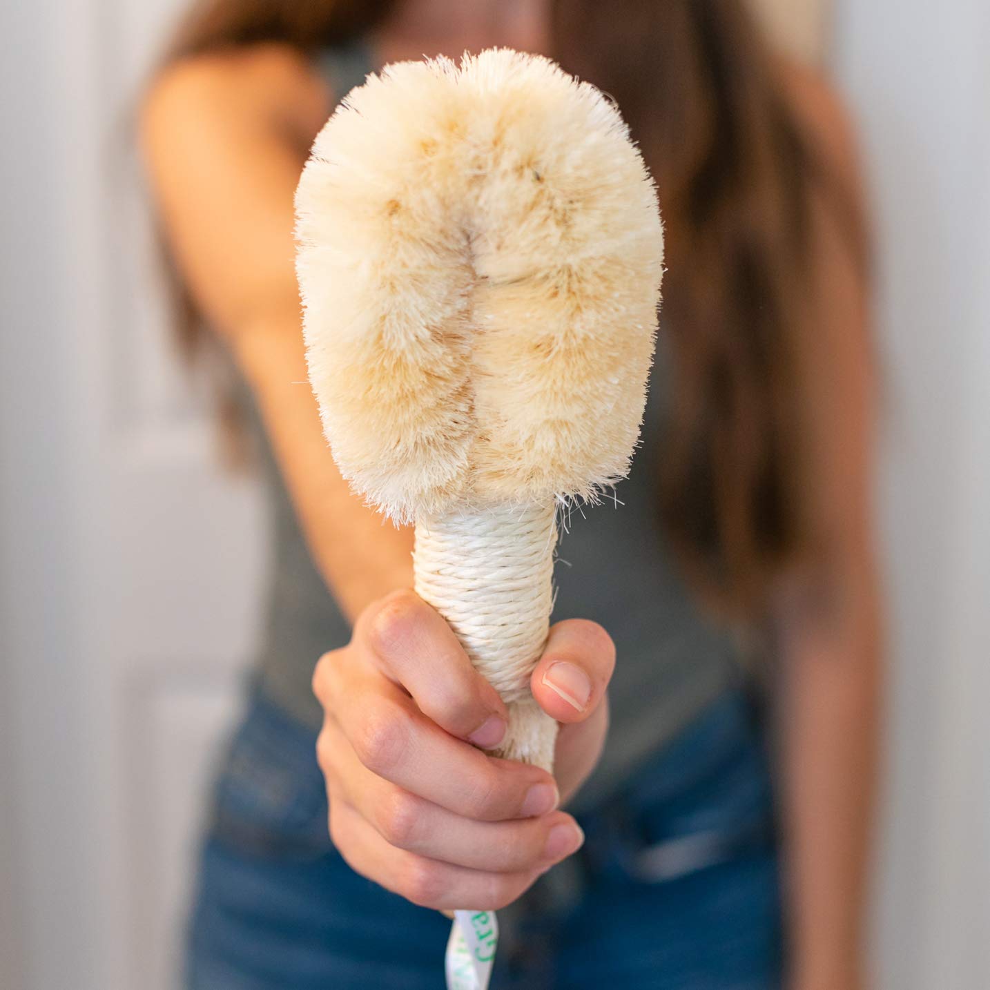 GranNaturals exfoliation detail on leg using sisal brush.