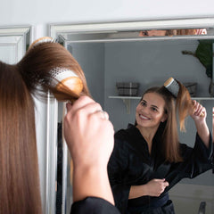 GranNaturals round hair brush with wooden handle provides comfortable grip.