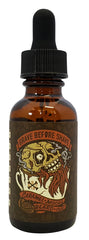 Grave Before Shave Caramel Mocha Beard Balm in use for tame flyaways.