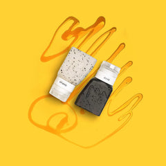 Gravel leak-proof travel bottles squeezed demonstrating controlled dispensing and spill protection