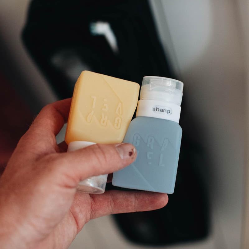 Gravel silicone travel bottles with label system simplify product identification on the go.