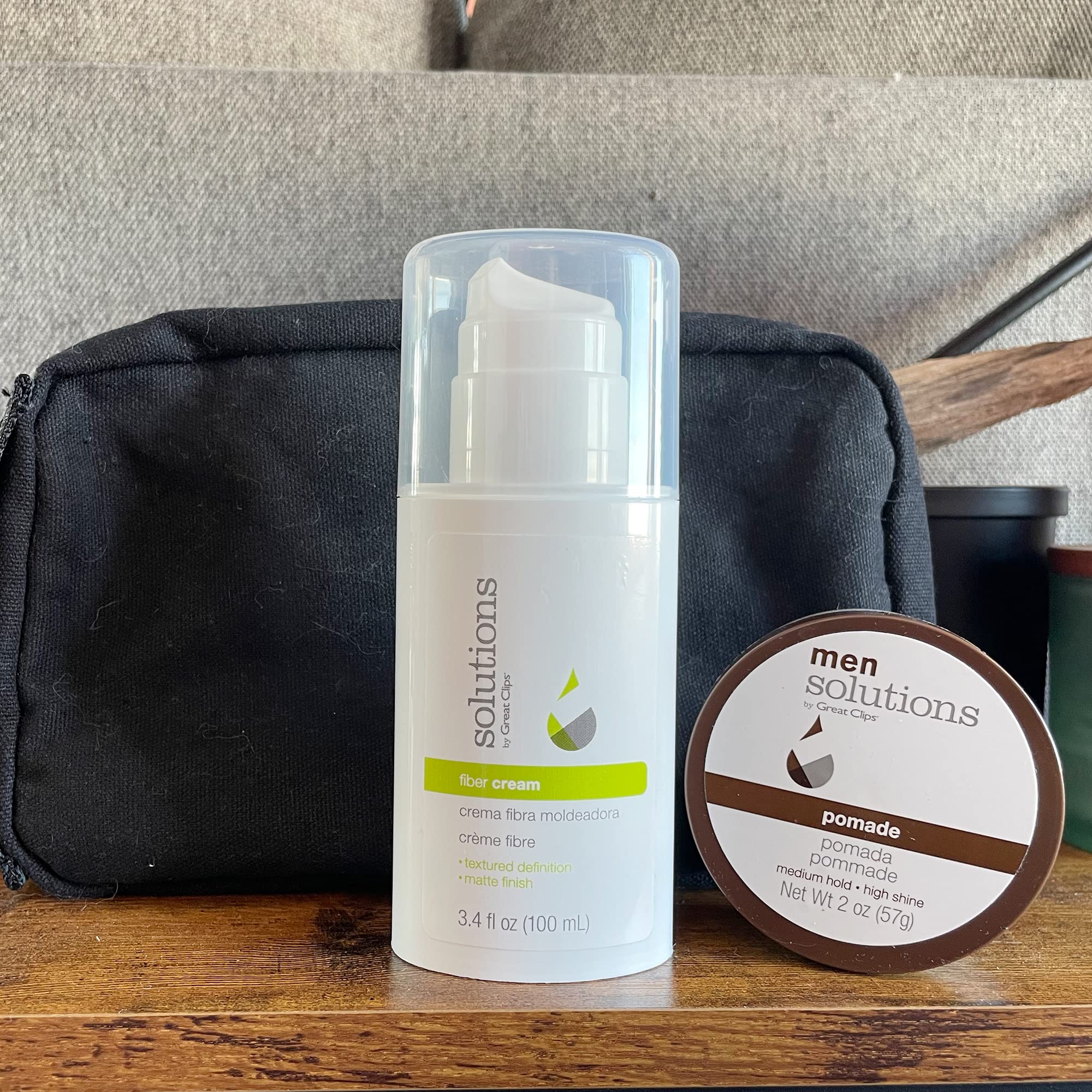 Great Clips Solutions Fiber Cream in hand illustrates pliable hold for curls.
