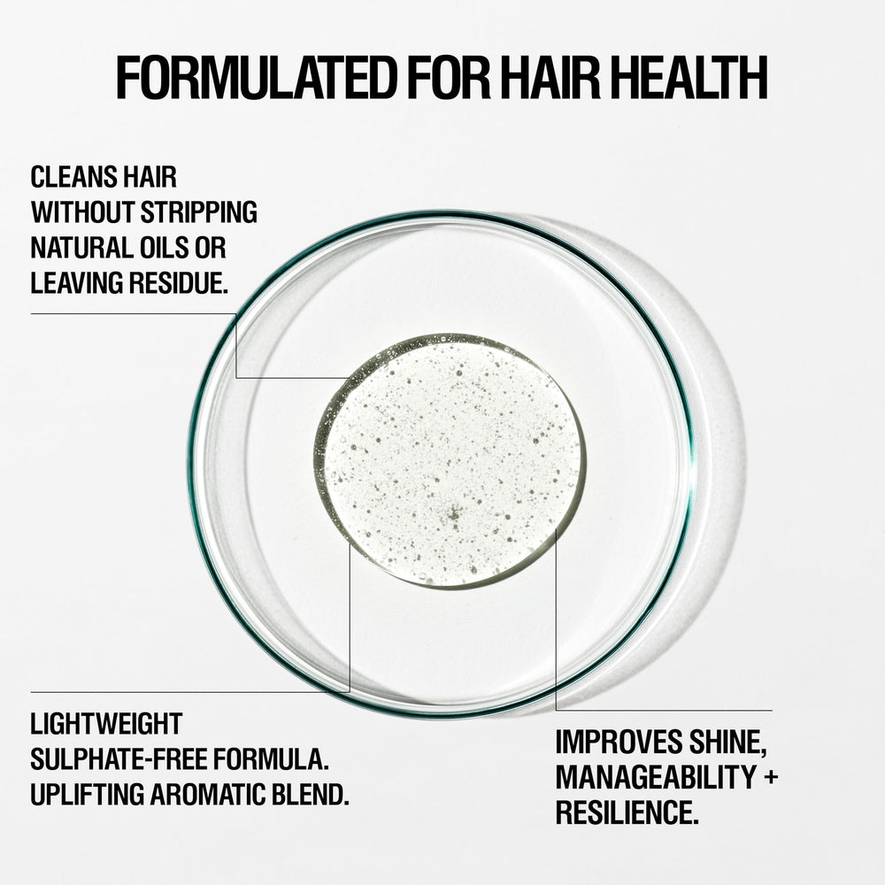 Grown Alchemist Hydra-Restore Conditioner bottle pour demonstrates smoothing and detangling for softer, manageable hair.