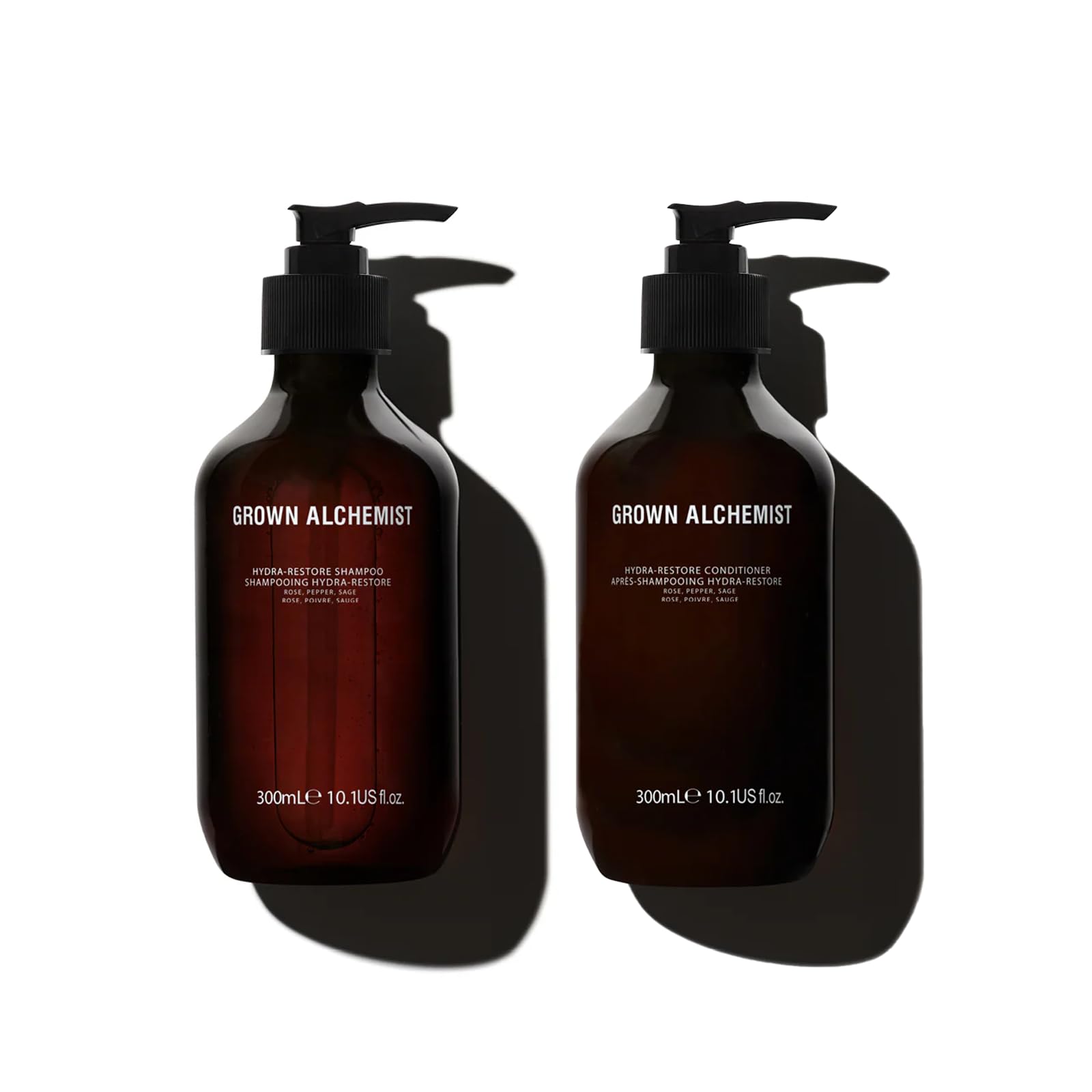 Grown Alchemist Hydra-Restore Shampoo bottle pour showing lightweight cleansing for hydrated, shiny hair.