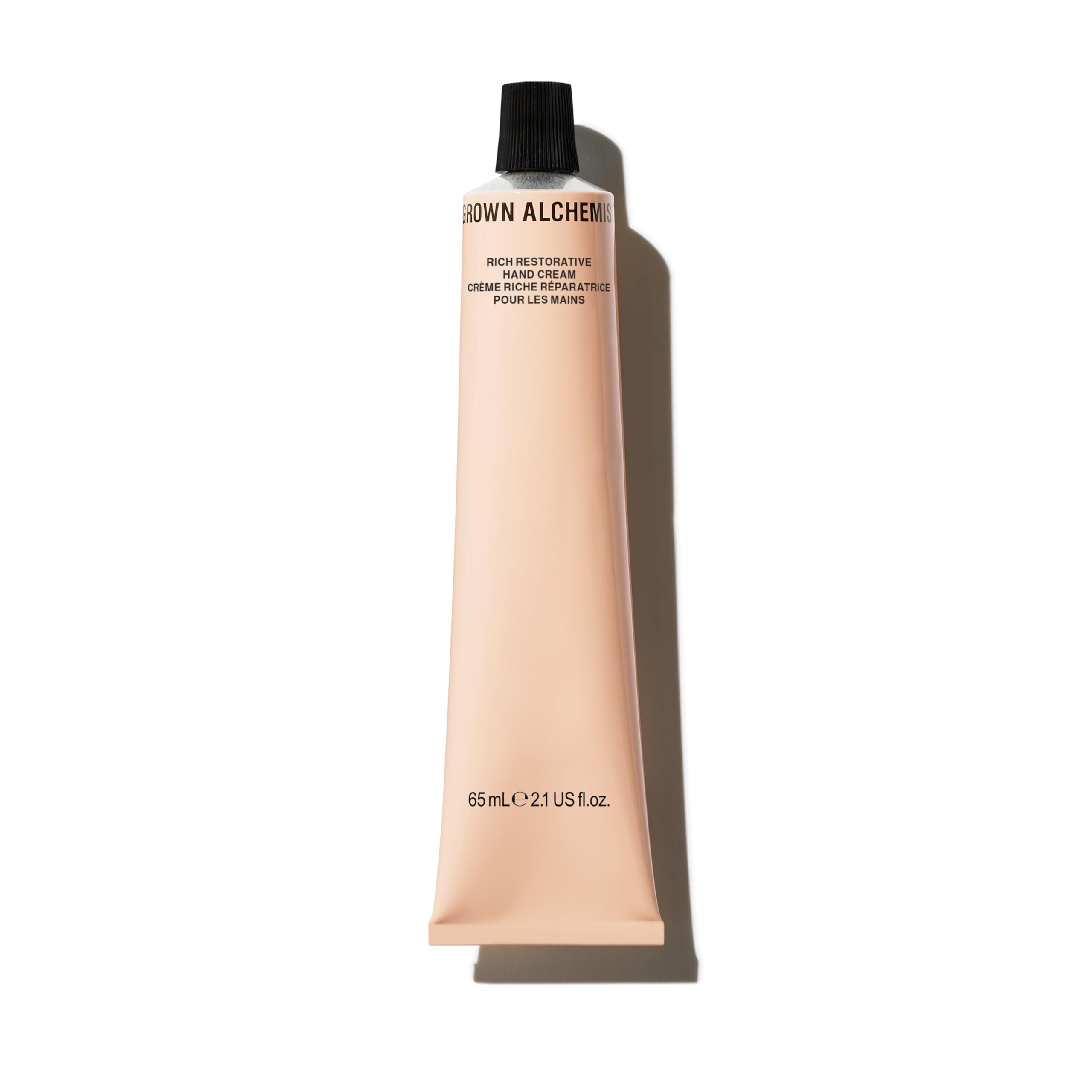 Grown Alchemist Rich Restorative Hand Cream jar shows silky texture for quick absorption.