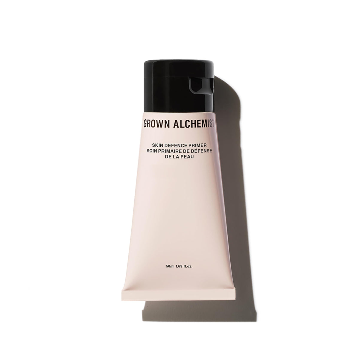 Grown Alchemist Skin Defense Primer bottle closeup showing hydrating base for prep-ready skin.