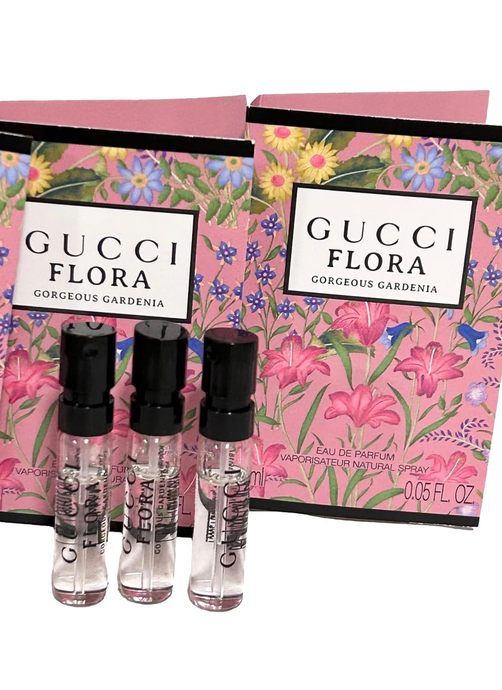 Gucci Flora sample mini bottles arranged for travel or gifting.